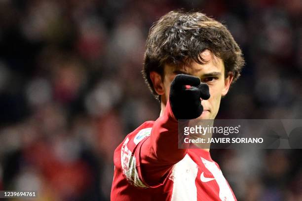 Atletico Madrid's Portuguese forward Joao Felix celebrates scoring his team's first goal during the Spanish League football match between Club...