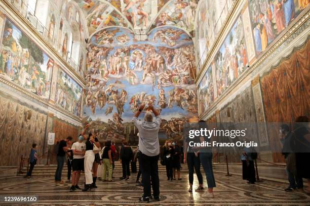 Vistors view the Sistine Chapel frescoes at the Vatican Museums on June 01, 2020 in Vatican City, Vatican. The Vatican Museums reopened today to the...