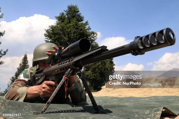 An Indian Army Soldier holds a Sniper as he takes position at a Forward Post at LoC Line Of Control in Uri, Baramulla, Jammu and Kashmir, India on 02...