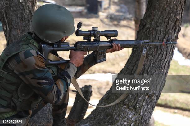 An Indian Army Soldier holds a Sniper as he takes position at a Forward Post at LoC Line Of Control in Uri, Baramulla, Jammu and Kashmir, India on 02...