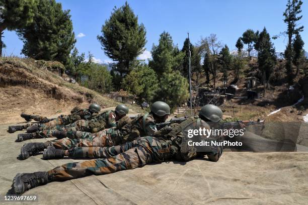 Indian army soldiers shoots a target during a practice session at a Forward Post at LoC Line Of Control in Uri, Baramulla, Jammu and Kashmir, India...