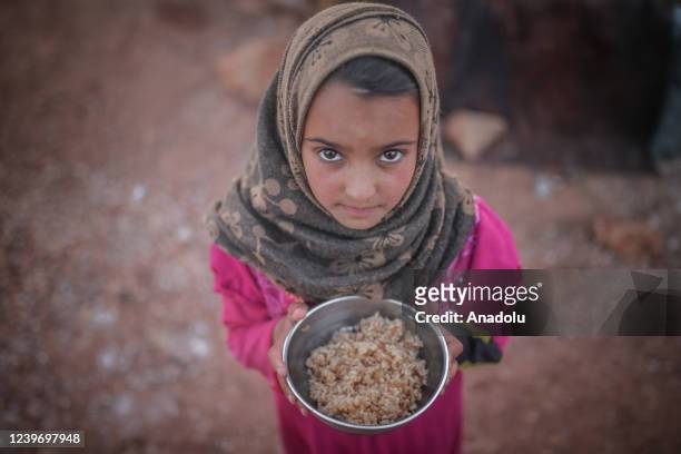Syrian people have fast-breaking dinner on the first day of Muslim's holy month Ramadan at refugee camps away from their home in Idlib, Syria on...