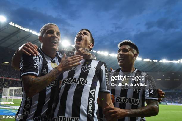 Nacho Fernández of Atletico Mineiro celebrates with teammate Guilherme Arana and Zaracho after scoring the second goal of their team during a match...