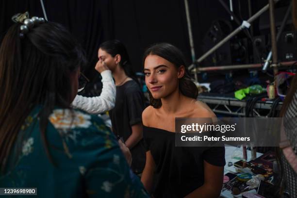 Models are seen having their makeup done backstage on April 2, 2022 in St Andrews, United Kingdom. This year's event will continue to combine the...