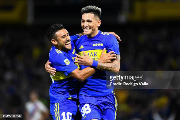 Luis Vazquez of Boca Juniors celebrates with teammate Eduardo Salvio after scoring the first goal of his team during a match between Boca Juniors and...