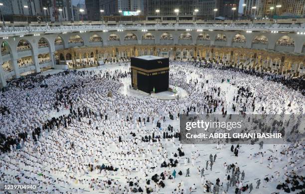 Muslims gather around the Kaaba, Islam's holiest shrine, at the Grand Mosque complex in the Saudi city of Mecca, ahead of prayers on the first day of...