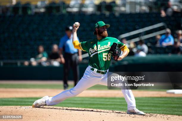 Paul Blackburn of the Oakland Athletics throws a fast ball during a Spring Training Baseball game between the Colorado Rockies and Oakland Athletics...