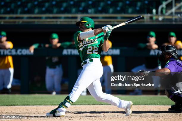 Ramon Laureano of the Oakland Athletics hits a pop fly to right field for an out during a Spring Training Baseball game between the Colorado Rockies...