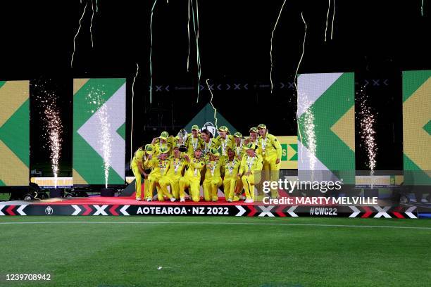 Australia team celebrate with the winning trophy after the Women's Cricket World Cup final match between England and Australia at Hagley Park Oval in...