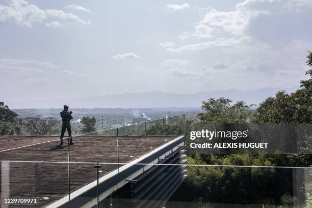 Virunga National Park guard stands guard at the Matebe hydroelectric plant in Rutshuru territory, north of Goma in eastern Democratic Republic of...
