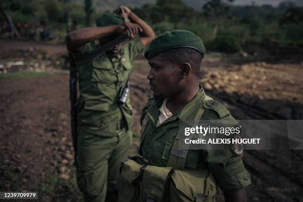 Virunga National Park guards stand guard at the Matebe hydroelectric plant in Rutshuru territory, north of Goma in eastern Democratic Republic of...