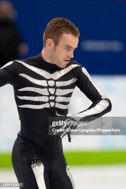 Kevin van der Perren of Belgium competing in the short program element of the men's single skating competition during the 2010 Winter Olympics at the...