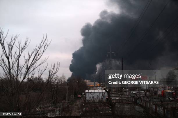 Heavy smoke is seen over buildings during the visit by the Greek minister of foreign affairs to the Black Sea port of Odessa on April 3, 2022. - The...