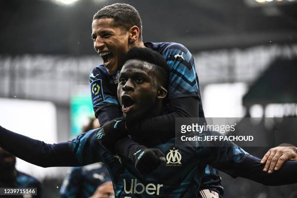 Marseilles Senegalese forward Bamba Dieng celebrates after scoring a goal during the French L1 football match between AS Saint-Etienne and Olympique...