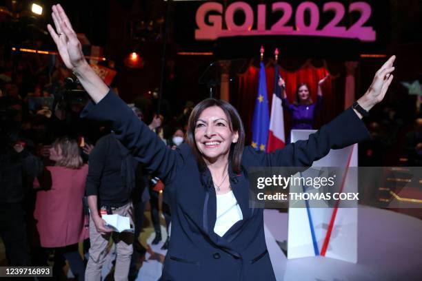 French Socialist Party presidential candidate Anne Hidalgo waves to supporters at the end of a campaign meeting a week before the first round of...