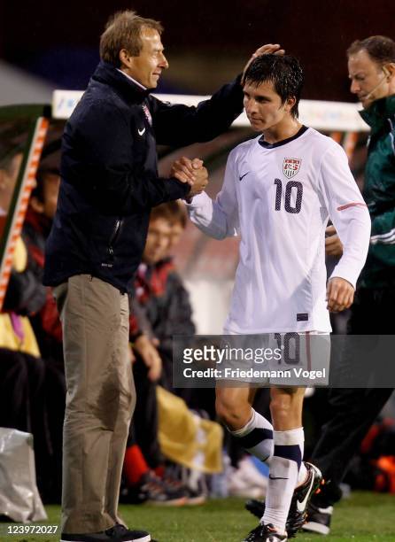 Head coach Juergen Klinsmann and Jose Torres of the United States shake hands during the international friendly match between Belgium and USA at Roi...