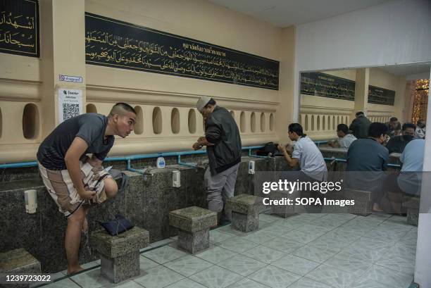 Muslims perform ablution in the mosque before prayers during the first day of Ramadan at Tonson Mosque in Bangkok. Ramadan is the ninth month of the...