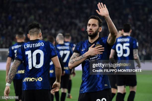 Inter Milan's Turkish midfielder Hakan Calhanoglu celebrates after opening the scoring with a penalty during the Italian Serie A football match...