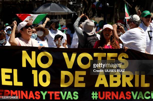 Opponents to Mexican President Manuel Lopez Obrador demonstrate against the presidential recall referendum that will take place next Sunday with a...