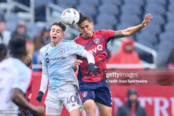 Chicago Fire midfielder Brian Gutiérrez and FC Dallas defender José Antonio Martínez battle for a header in action during a game between the Chicago...