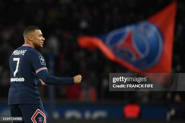 Paris Saint-Germain's French forward Kylian Mbappe celebrates after scoring the 3-1 goal during the French L1 football match between Paris...