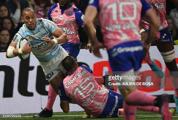 Racing92's French centre Gael Fickou is tackled during the French Top14 rugby union match between Racing92 and Stade Francais Paris at Paris La...