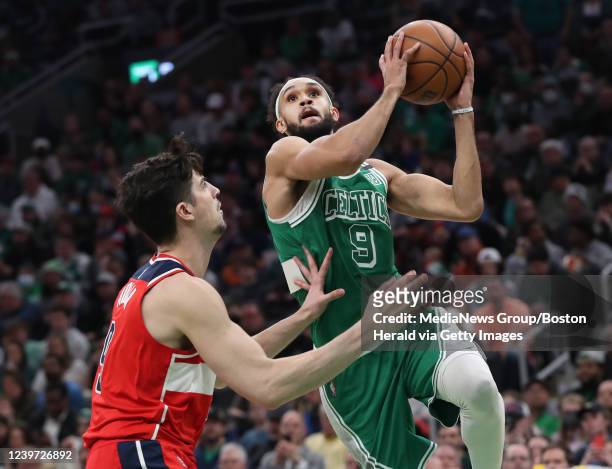 Boston Celtics guard Derrick White drives to the basket past Washington Wizards forward Deni Avdija during the 3rd quarter of the game at the TD...