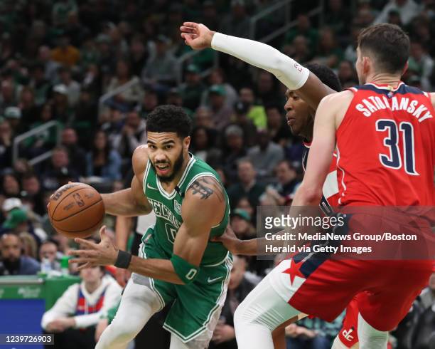 Boston Celtics forward Jayson Tatum drives the basket past Washington Wizards guard Tomas Satoransky during the 3rd quarter of the game at the TD...