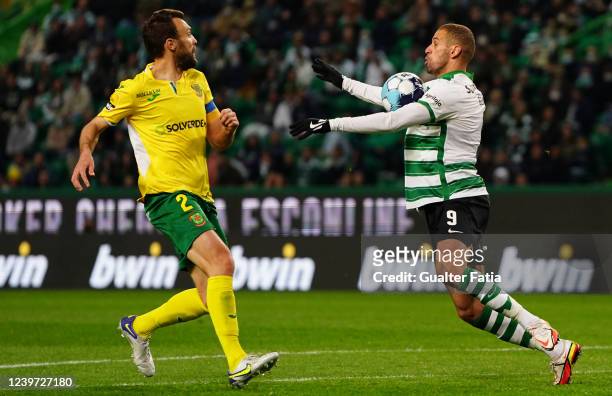 Islam Slimani of Sporting CP with Marco Baixinho of FC Pacos de Ferreira in action during the Liga Bwin match between Sporting CP and FC Pacos de...
