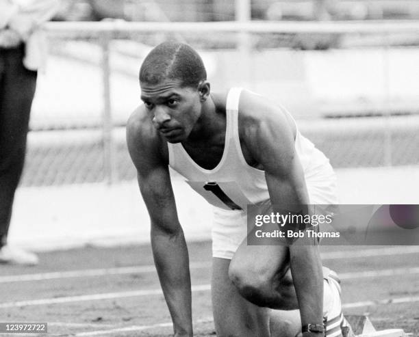 American Olympic athlete Bob Hayes competing in the 100 metres during an athletics meeting at the White City Stadium in London, circa 1964.