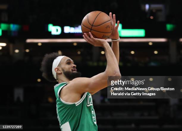 Boston Celtics guard Derrick White tosses up a three pointer during the 3rd quarter of the game against the Washington Wizards at the TD Garden on...