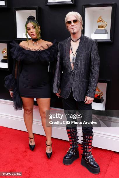 Rita Lowery and John 5 of Rob Zombie arrives at THE 64TH ANNUAL GRAMMY AWARDS, broadcasting live Sunday, April 3 on the CBS Television Network, and...