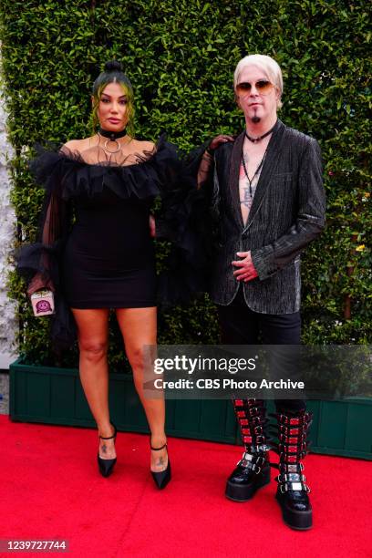 Rita Lowery and John 5 of Rob Zombie arrives at THE 64TH ANNUAL GRAMMY AWARDS, broadcasting live Sunday, April 3 on the CBS Television Network, and...