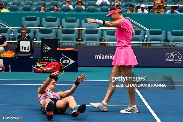 Laura Siegemund of Germany and Vera Zvonareva of Russia celebrate after the womens doubles final trophy at the 2022 Miami Open at Hard Rock Stadium...