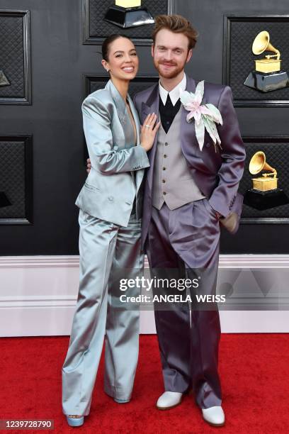 Singer-songwriter Finneas O'Connell and Claudia Sulewski arrive for the 64th Annual Grammy Awards at the MGM Grand Garden Arena in Las Vegas on April...