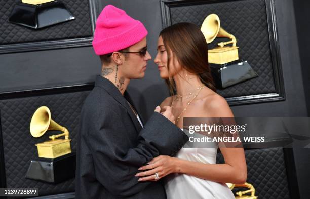Canadian singer-songwriter Justin Bieber and US model Hailey Bieber arrive for the 64th Annual Grammy Awards at the MGM Grand Garden Arena in Las...