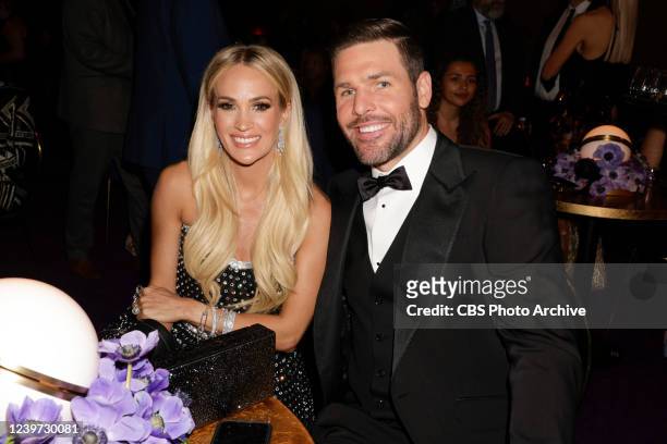 And husband MIKE FISHER at THE 64TH ANNUAL GRAMMY AWARDS, broadcasting live Sunday, April 3 on the CBS Television Network, and available to stream...