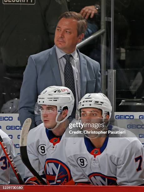 New York Islanders assistant coach John Gruden looks on from the bench during the third period against the New Jersey Devils at the Prudential Center...