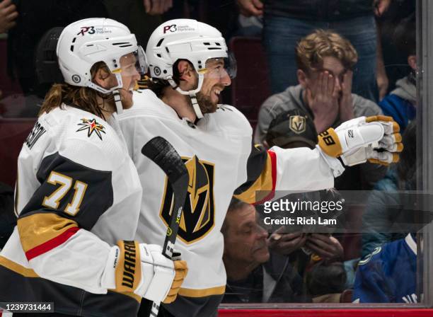 Shea Theodore of the Las Vegas Golden Knights celebrates with teammate William Karlsson after scoring the game-winning goal in overtime against the...