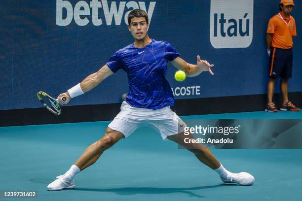 Carlos Alcaraz of Spain hits a forehand against Casper Ruud of Norway during their Women's Singles final match at the Miami Open at Hard Rock Stadium...