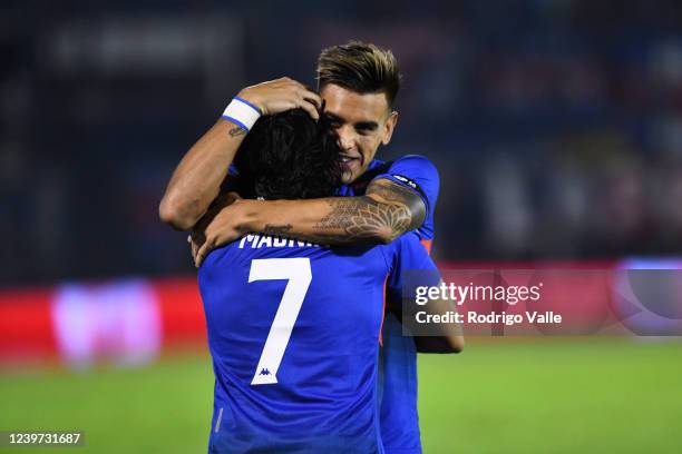 Pablo Magnin of Tigre celebrates with teammate Alexis Castro after scoring the first goal of his team during a match between Tigre and Rosario...