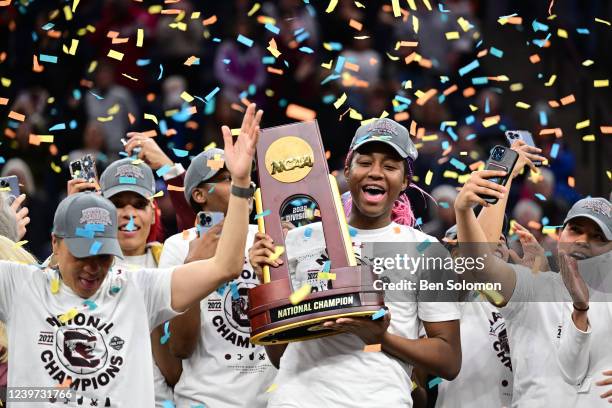 Aliyah Boston of the South Carolina Gamecocks holds the trophy after a win over the Connecticut Huskies in the championship game of the NCAA Women's...