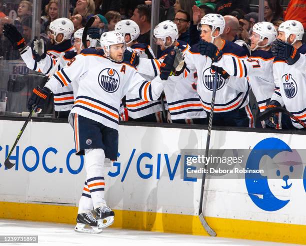 Leon Draisaitl of the Edmonton Oilers celebrates his third-period goal against the Anaheim Ducks with the bench during the game at Honda Center on...