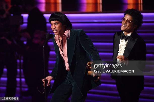 Duo Silk Sonic members US singer Bruno Mars and US rapper Anderson Paak accept the award for Record Of The Year for "Leave The Door Open" during the...