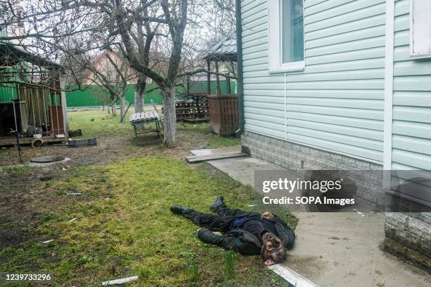 Dead body of a civilian is lying in the house yard in Bucha, a suburb north of Kyiv, where the war between Russian Federation forces and the...