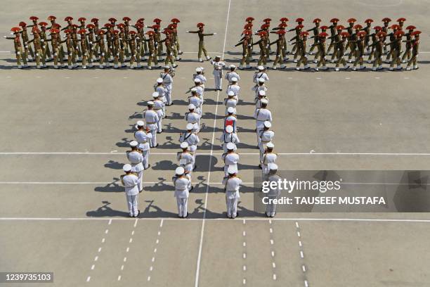 Indian Border Security Force new recruits take part in a passing out parade in Humhama on the outskirts of Srinagar on April 4,2022.