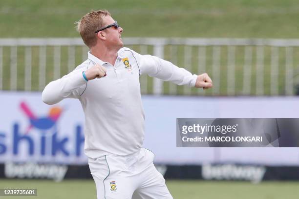 South Africa's Simon Harmer celebrates after the dismissal of Bangladesh's Mehidy Hasan Miraz during the fifth day of the first Test cricket match...