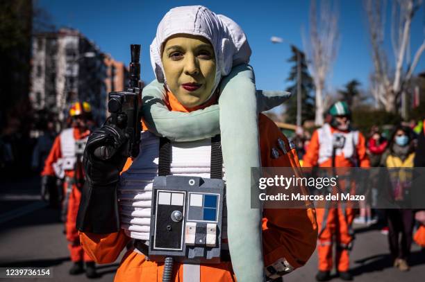 Woman dressed as a member of the Rebel pilots is seen marching during a Star Wars Parade in the Aluche neighborhood of Madrid. Nearly 300 people have...