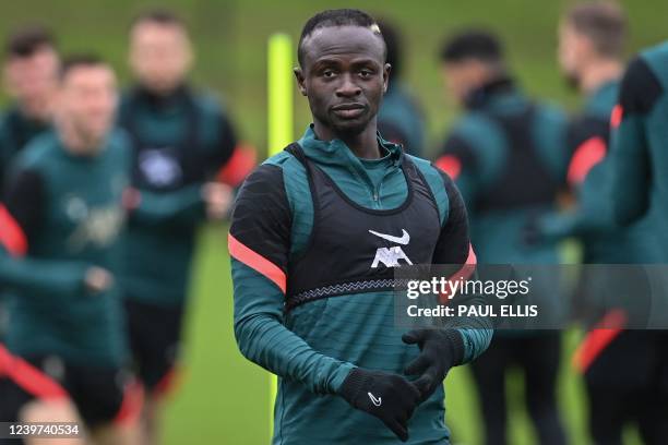 Liverpool's Senegalese striker Sadio Mane reacst during a training session at the Liverpool FC training ground in Liverpool, north west England, on...