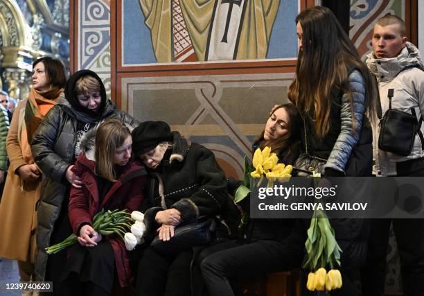 Relatives and friends attend the funeral ceremony of late Ukrainian photographer and documentary maker Maks Levin at the Mykhaylovsky Golden Dome...